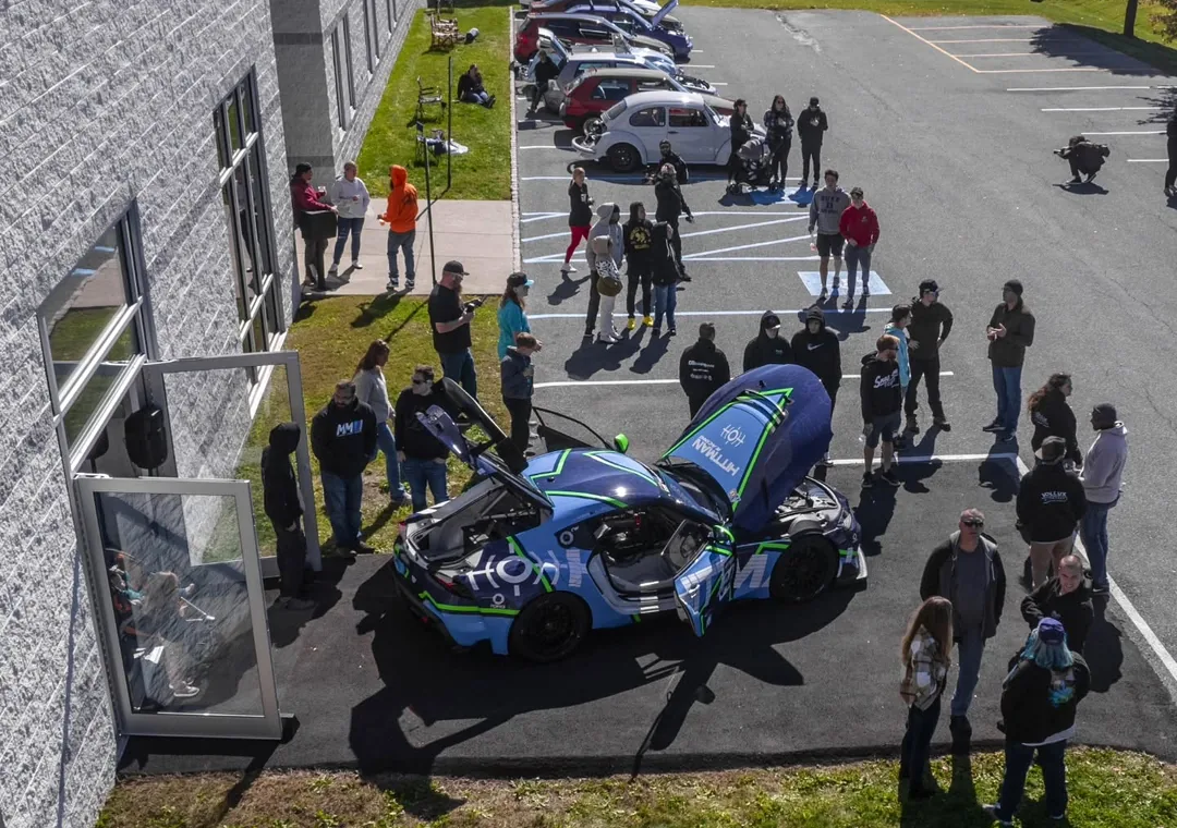 Cars and spectators gathered outside Vollux Autowerks during a previous Dyno Day