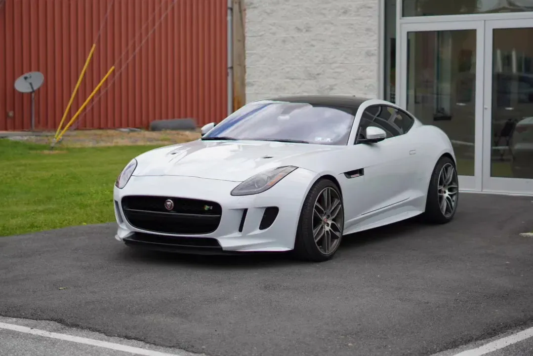 White Jaguar F-Type R outside the shop