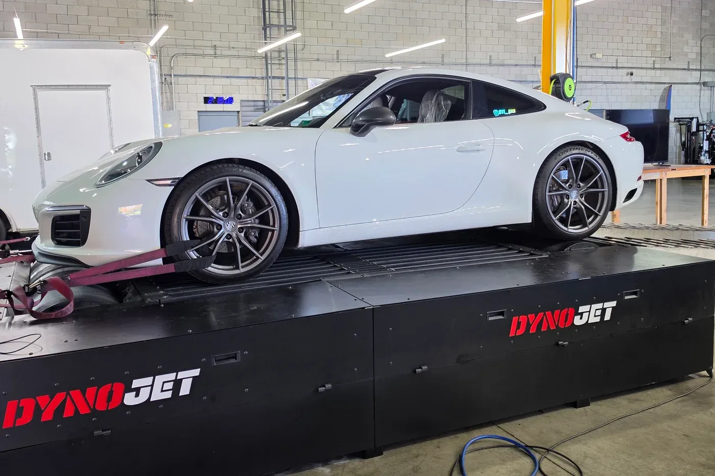 White Porsche 991.2 911 Carrera T on the AWD Dynojet at Vollux Autowerks
