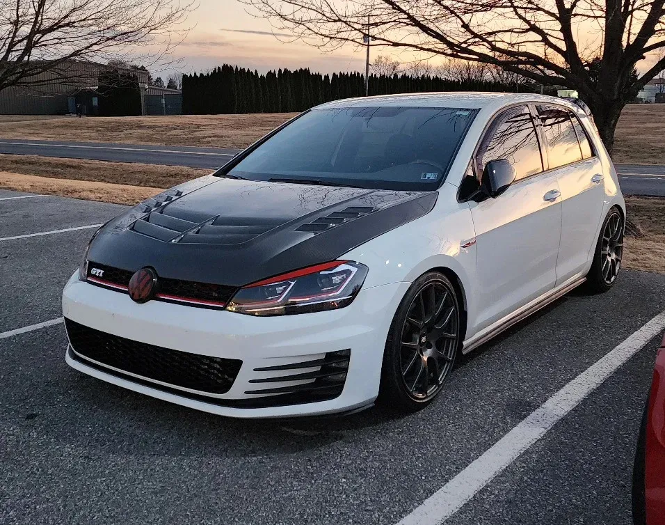 White Volkswagen Mk7 GTI outside the shop