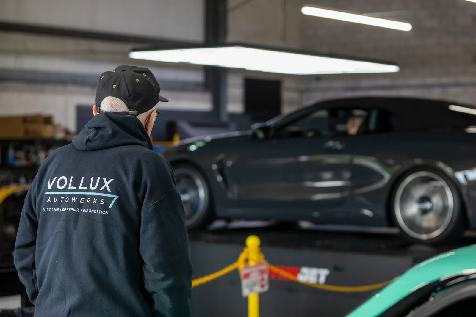 Vollux in the foreground, with a car on the dyno behind.