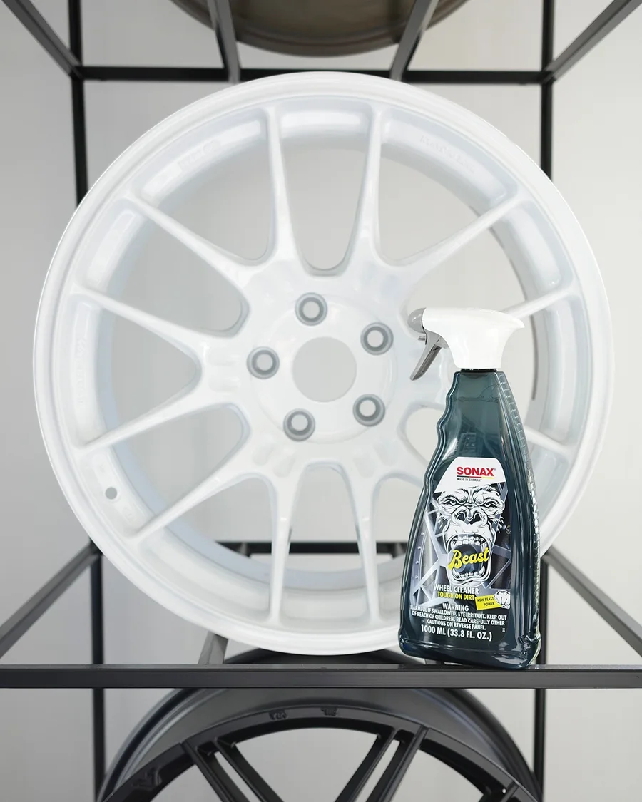 SONAX The Beast Wheel Cleaner displayed beside a white wheel at Vollux